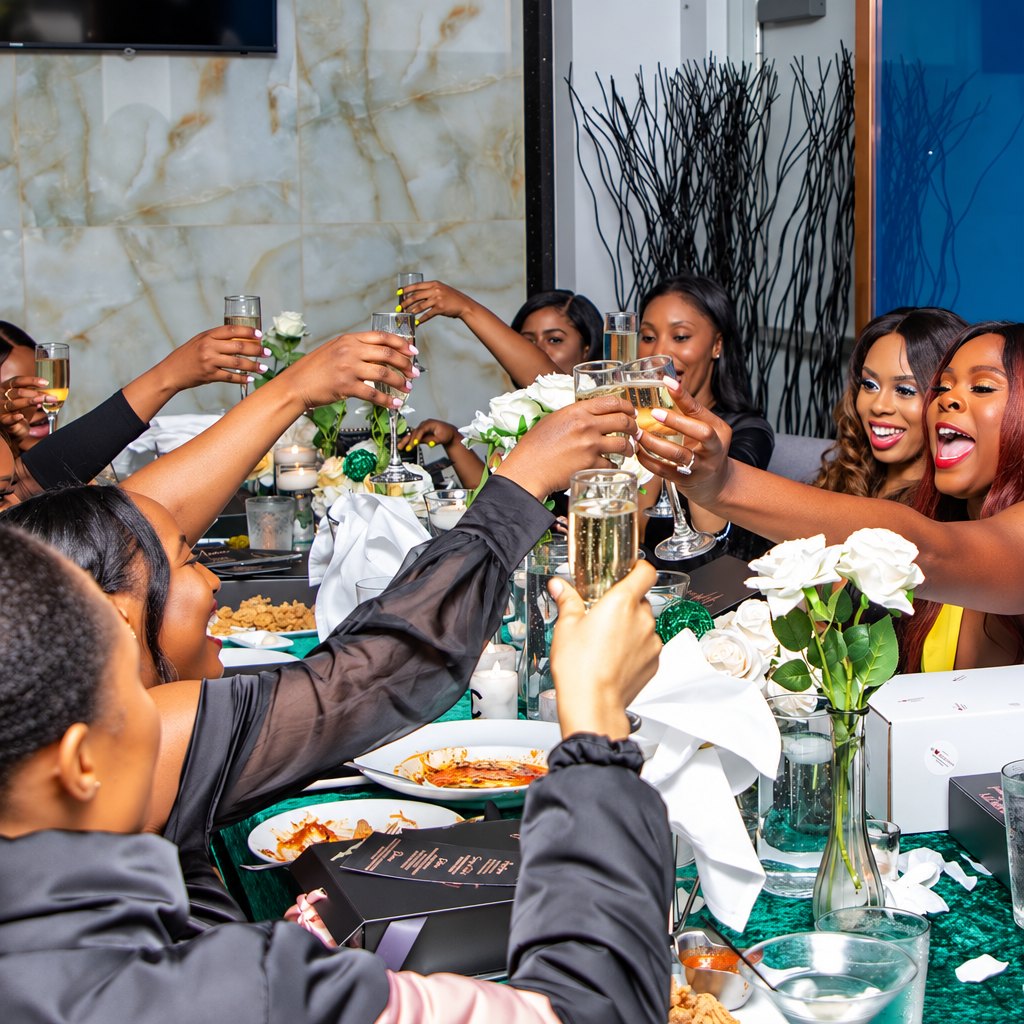 Guests raising a toast at a dinner with white roses